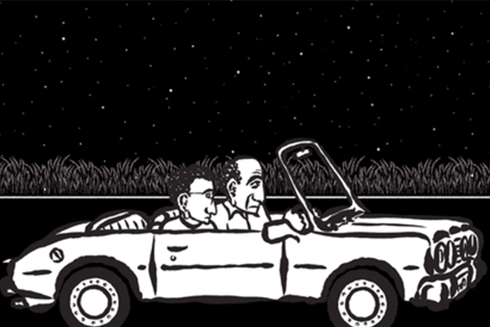 A father and son driving in a convertible car