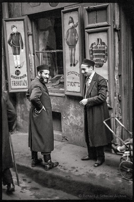 Men in front of clothing store, Warsaw, Poland