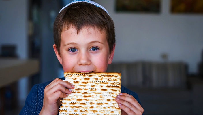 boy eat a matzah