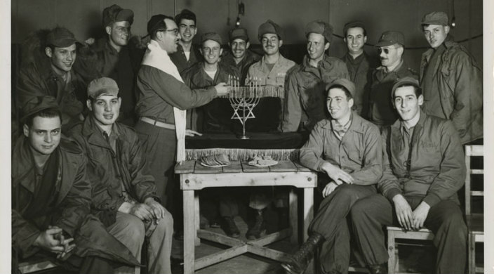 Chaplain lighting Hanukkah candles for Jewish troops in Korea
