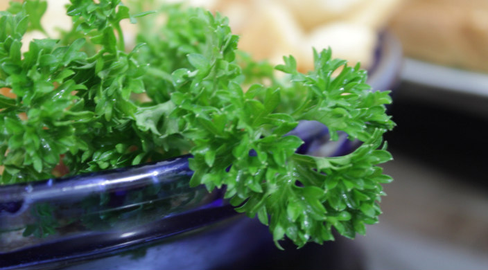Parsley in a blue ceramic bowl