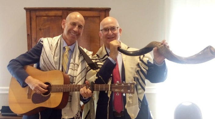 The author (holding guitar) and his husband (with shofar) at High Holiday services in Milan