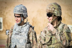 Two smiling woman in army uniforms 