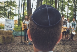 a Boy at Jewish summer camp wearing a kippah or yarmulke