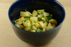 Ethiopian potato salad in a blue bowl