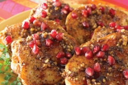 Chicken Fesenjan topped with pomegranate arils