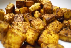 Cubes of oven fried curried tofu 