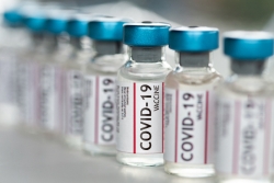Small vials of COVID 19 vaccine