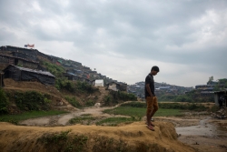 Profile of a man walking through a Rohingya refugee camp in Bangladesh