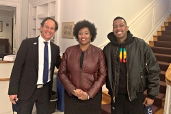 Rabbi Jonah Pesner and Yolanda Savage Narva pose with Nick Cannon in the foyer of the RAC building
