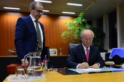 IAEA Director Yukia Amano clears a report paving the way for full implementation of the JCPOA.