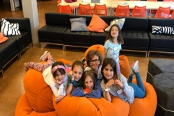 Children playing together in a lounge area