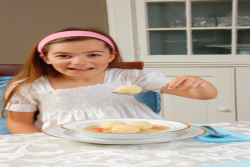 Girl holding a Matzah Ball for the Jewish holiday of Passover or Pesach