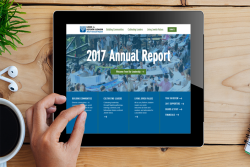 Overhead shot of a person accessing the URJ's 2017 annual report on a tablet device