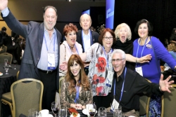 Group of happy people with arms up celebrating at the last URJ Biennial 