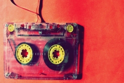 Red cassette tape lightly unspooling