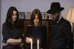 Scene from the film, Disobedience; main characters are lighting Shabbat candles