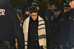 Rabbi Rachel Timoner being arrested by NYPD while wearing a prayer shawl