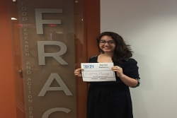 Ilana Symons in front of FRAC sign with MK is sign