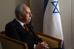 Shimon Peres, seated