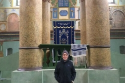 The author standing in front of a synagogue in Poland