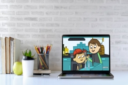Bright and airy desktop with a laptop screen open to an animated Shaboom Shabbat video