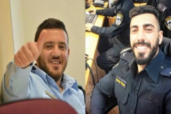 Two smiling dark haired male police officers are the two Druze policemen who were killed in a terrorist attack near the Temple Mount