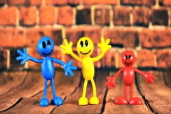 Bendy childrens toys in primary colors with cartoony smiling faces