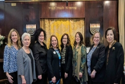 Reform Jewish women pose together in from of an ark while in Israel together during Rosh Chodesh