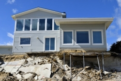 House with damage from hurricane/beach erosion