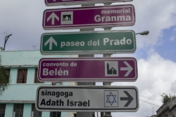 Directional signs in Old Havana Cuba, including one to a synagogue