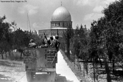 Black and white image of Israeli soldiers in a tank approaching the Dome on the Rock in Jerusalem on June 7 1967 