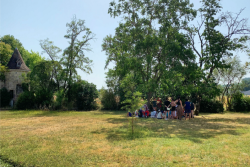Campers gathered near a tree at a Jewish camp in the south of France