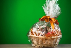 Cellophane-wrapped, bow-tied gift basket