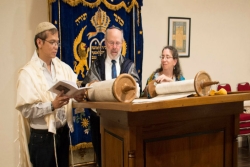 Reading from the Indonesian Jewish community's new Torah scroll