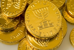 A pile of gelt, or chocolate coins in gold colored wrapping