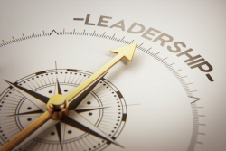 Compass with arrow pointing at Leadership