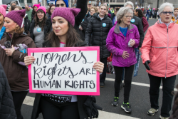 Woman with sign that says "Women's Rights are Human Rights"