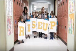 Children at Davis Academy spelling out Rise Up