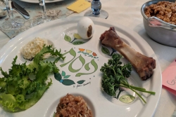 Closeup of a seder plate and a table setting