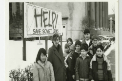 Group of students and a teacher standing in front of a sign: Help Save Soviet Jews